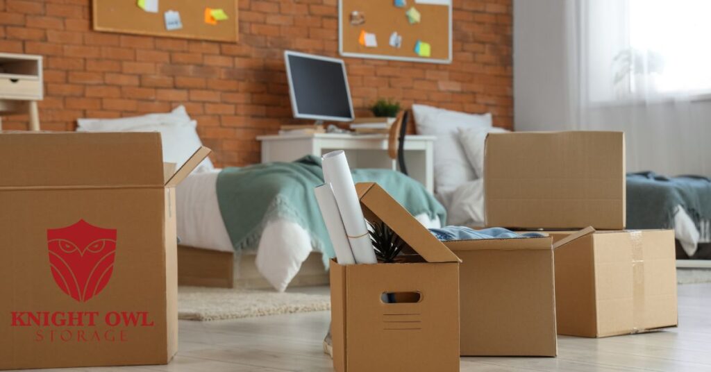 Cardboard moving boxes in a bedroom for storage at Knight Owl Storage HWY90